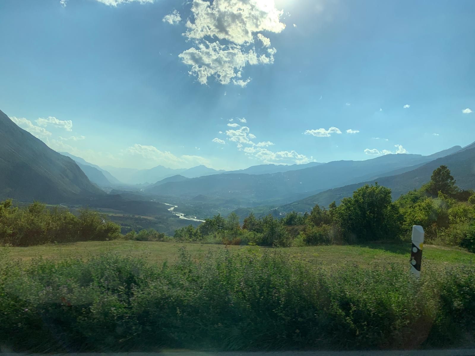 The Rhône valley stretching into the distance under a bright sky